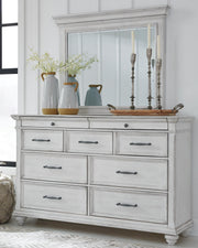 kanwyn-king-upholstered-panel-bed-dresser-mirror-and-chest-13